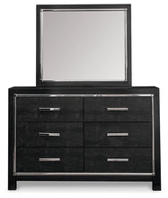 Load image into Gallery viewer, Kaydell King Upholstered Panel Headboard with Mirrored Dresser and Chest
